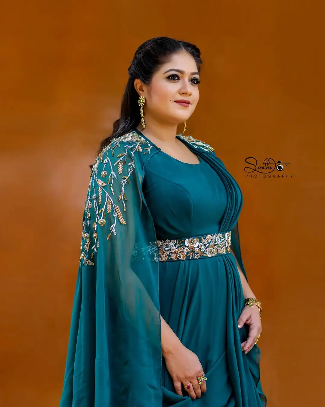 Meghana Raj Wearing Beautiful Earring Blue Gown